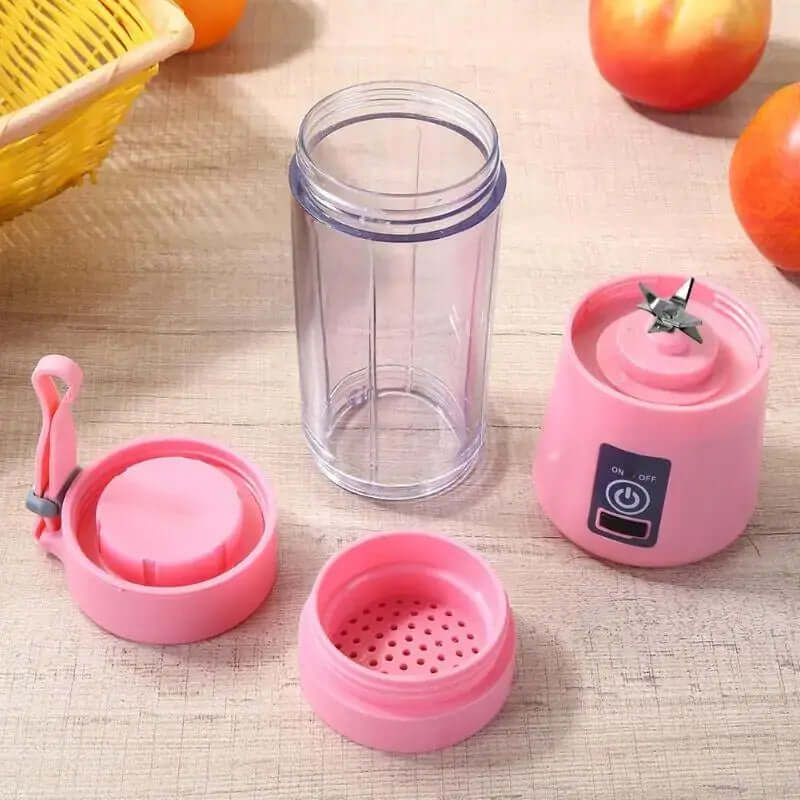 Portable juicer cup electric glass blender in pink, ideal for smoothies with fruits and vegetables on-the-go.