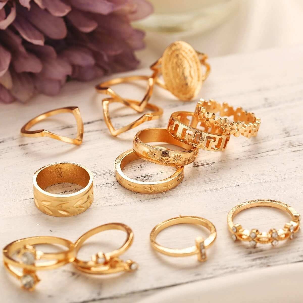 The 13-Piece Medallion Ring Set combines elegance and versatility with its intricate designs and shimmering Austrian crystals. Each ring is 18K gold-plated, ensuring a luxurious finish and long-lasting brilliance.