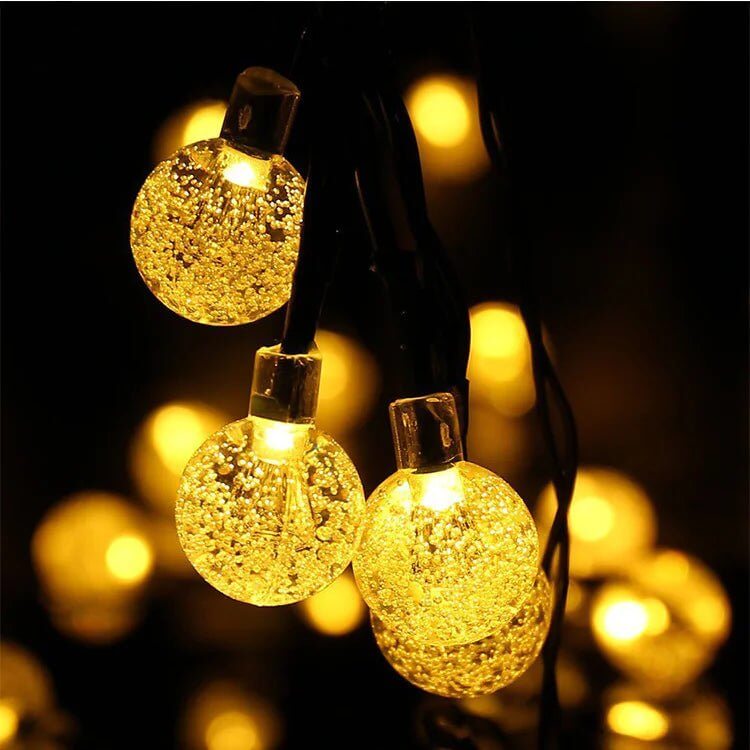 The 60 LED Solar String Lights are the perfect addition to your indoor or outdoor décor, combining functionality with style. Featuring crystal globe lights, these energy-efficient, solar-powered lights offer 8 lighting modes to create the ideal ambiance for any occasion. Built to withstand the elements with a waterproof design, they are perfect for gardens, patios, parties, or holiday decorations. Easy to install and eco-friendly, these string lights add a warm and magical touch to your space, day or night.