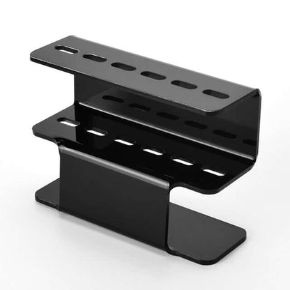 The Acrylic Eyelash Tweezers Holder is the perfect organizer for lash artists and beauty enthusiasts. Crafted from durable, transparent acrylic, this sleek holder keeps your tweezers neatly displayed and easily accessible. Designed to hold multiple tools, it helps maintain a clean, professional workspace while protecting your tweezers from damage. 