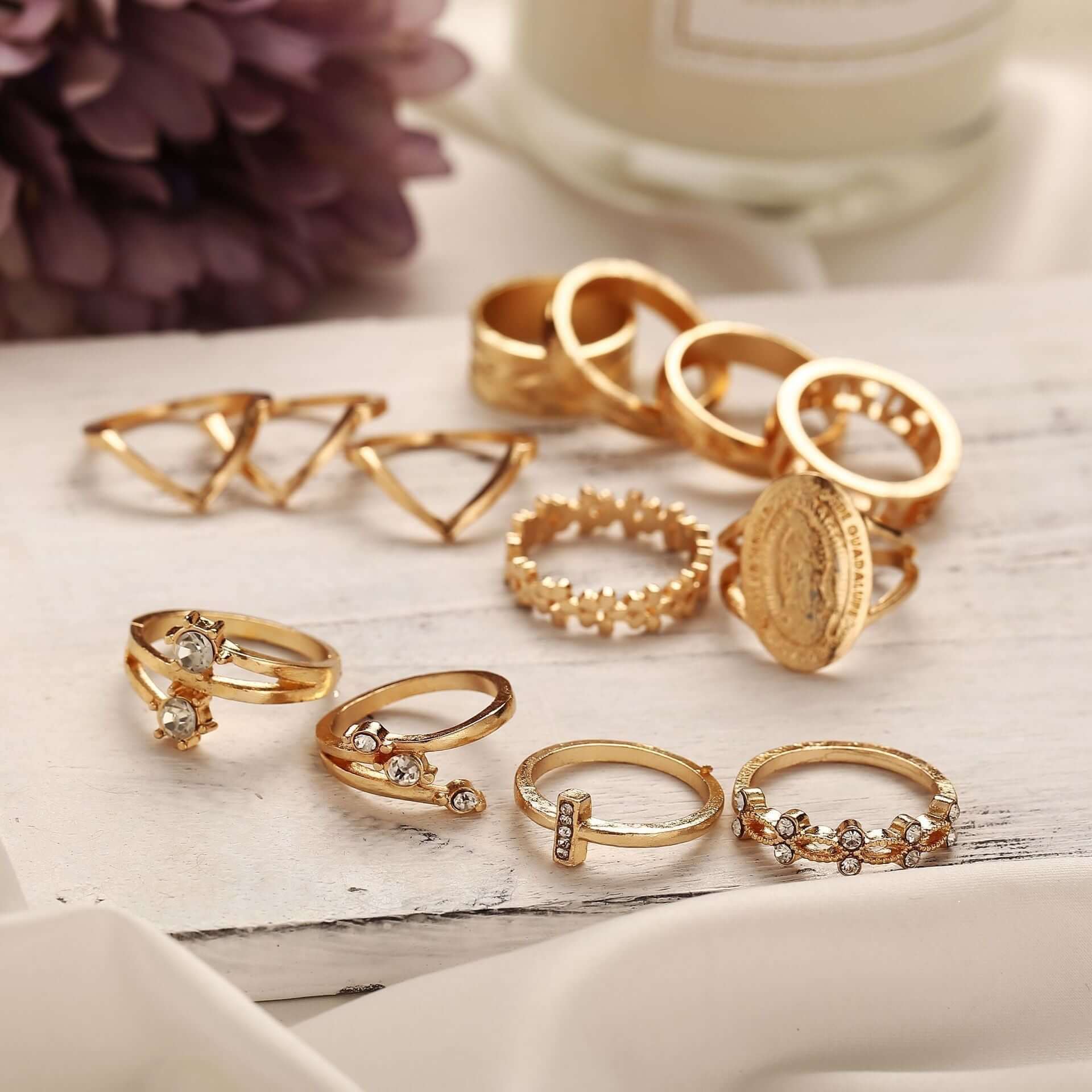 The 13-Piece Medallion Ring Set combines elegance and versatility with its intricate designs and shimmering Austrian crystals. Each ring is 18K gold-plated, ensuring a luxurious finish and long-lasting brilliance. 