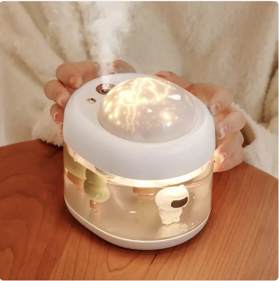
The 360° Rotating Projection Humidifier combines advanced humidification with a unique visual experience. Featuring a large-capacity water tank, it provides long-lasting moisture to improve air quality in your home or office. The 360-degree rotating projection adds a soothing ambiance with adjustable light patterns, making it perfect for relaxation or bedtime use. 