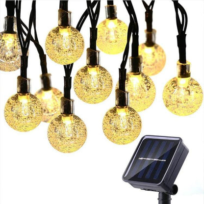 The 60 LED Solar String Lights are the perfect addition to your indoor or outdoor décor, combining functionality with style. Featuring crystal globe lights, these energy-efficient, solar-powered lights offer 8 lighting modes to create the ideal ambiance for any occasion. Built to withstand the elements with a waterproof design, they are perfect for gardens, patios, parties, or holiday decorations. Easy to install and eco-friendly, these string lights add a warm and magical touch to your space, day or night.